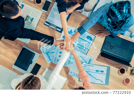 Teamwork business people join hands in meeting. Teamwork business people join hands in meeting. 77222910