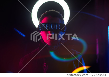 Cyberpunk style portrait of man in futuristic costume. 77223581