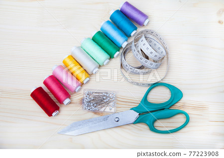 spools of thread, pins, centimeter, scissors 77223908