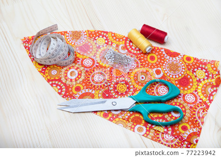 fabric, scissors, thread, centimeter, spool of thread fabric, scissors, thread, centimeter, spool of thread 77223942