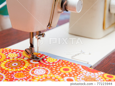foot sewing machine and fabric closeup foot sewing machine and fabric closeup 77223944