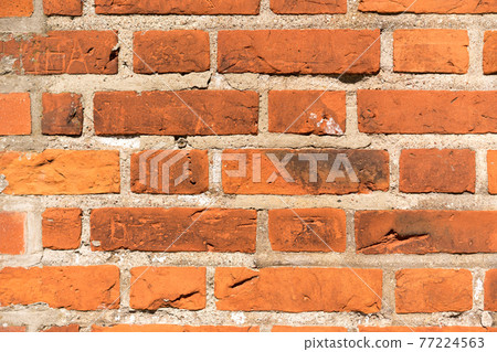 brick red wall. background of a old brick house. brick red wall. background of a old brick house. 77224563