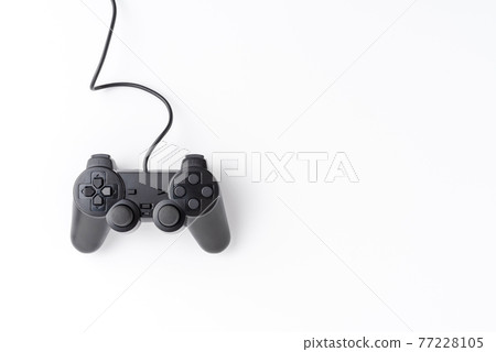 Video game controller isolated on white background with copyspace. Computer player concept. Top view Video game controller isolated on white background with copyspace. Computer player concept. Top view 77228105