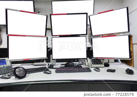 group of blank monitors and screen on security desk or control room for monitor process or stock data trading. group of blank monitors and screen on security desk or control room for monitor process or stock data trading. 77228579