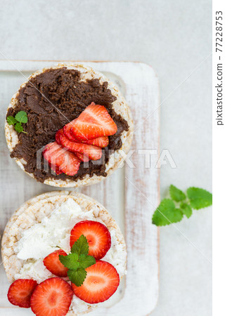Healthy Snack from Rice Cakes with Hazelnut Spread, Ricotta Chee Healthy Snack from Rice Cakes with Hazelnut Spread, Ricotta Chee 77228753