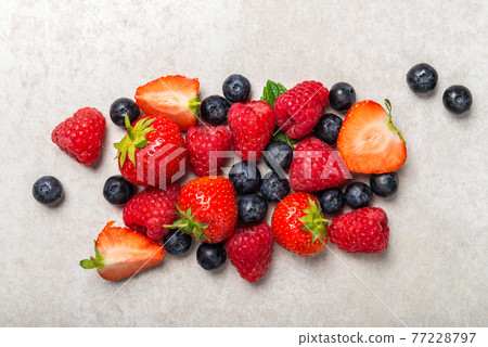 Fresh summer berries such as blueberries, strawberries, raspberries 77228797