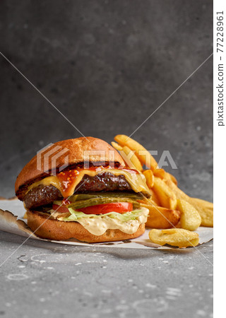 American cuisine. Royal Cheese Burger of Marble Beef with cucumbers, cheese and sauce. Healthy, tasty, nourishing snack 77228961