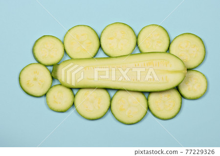 Perfectly retouched zucchini isolated on blue. Perfectly retouched zucchini isolated on blue. 77229326