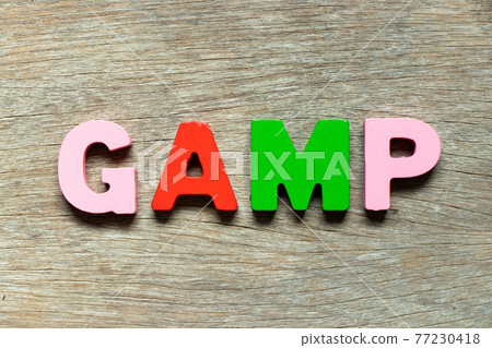 Color alphabet letter in word GAMP (Abbreviation of Good Automated Manufacturing Practice) on wood background 77230418