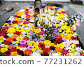 Flower hand water with colorful flowers floating 77231262