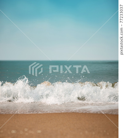 Sand Beach and Hard Wave on Summer Sunny Day. Blue Ocean and Sky as background. Low angle View. Focus on Water Ripple Swash Sand Beach and Hard Wave on Summer Sunny Day. Blue Ocean and Sky as background. Low angle View. Focus on Water Ripple Swash 77233037