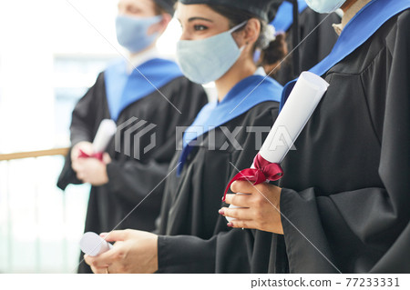 Graduates wearing masks in row 77233331