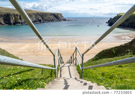 The stairs down to the Silver Strand in County Donegal - Ireland 77233803
