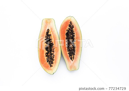 Isolated two halves of papaya fresh tropical fruit on white background 77234729
