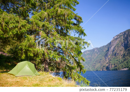 Wild camping by a lake in Norway 77235179