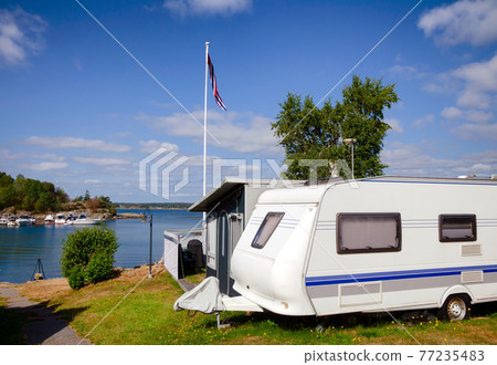 Camper trailer at norwegian seaside caravan park 77235483