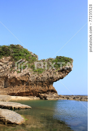 Rocks carved by the waves 77235528