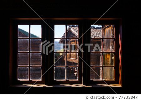 Old traditional Norwegian wooden house window Maihaugen Folks museum Lillehammer Oppland Norway Scandinavia Old traditional Norwegian wooden house window Maihaugen Folks museum Lillehammer Oppland Norway Scandinavia 77235847