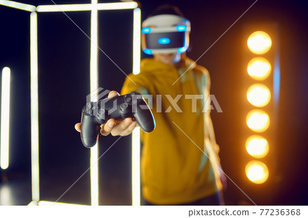 Man leisures using virtual reality headset Man leisures using virtual reality headset 77236368