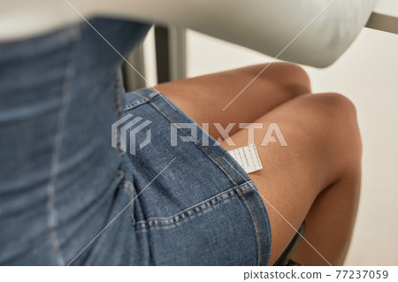 Girl hiding cheat note Girl hiding cheat note 77237059