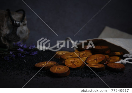 homemade wooden runes on a dark background homemade wooden runes on a dark background 77240917