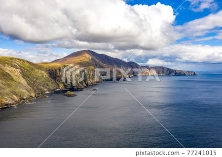 Aerial view of the beautiful coast at Malin Beg with Slieve League in the background in County Donegal, Ireland Aerial view of the beautiful coast at Malin Beg with Slieve League in the background in County Donegal, Ireland 77241015