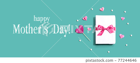 Happy Mothers day message with a gift box and hearts Happy Mothers day message with a gift box and hearts 77244646
