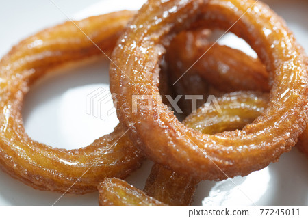 Traditional Turkish ring sweet dessert Halka Tatli. Fried circle desserts. Arabic Ramadan Kareem sweet desserts 77245011