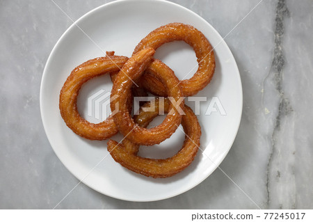 Traditional Turkish ring sweet dessert Halka Tatli. Fried circle desserts. Arabic Ramadan Kareem sweet desserts 77245017