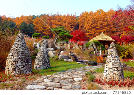Stone Pagoda in a beautiful garden. Stone stack 77246850