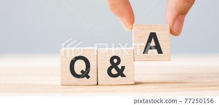 Hand holding Q and A word with wooden cube block. FAQ( frequency asked questions), Answer, Question Ask, Information, Communication and Brainstorming Concepts Hand holding Q and A word with wooden cube block. FAQ( frequency asked questions), Answer, Question Ask, Information, Communication and Brainstorming Concepts 77250156