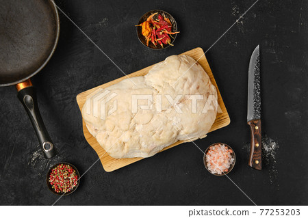 Overhead view of lamb fat tail on kitchen table Overhead view of lamb fat tail on kitchen table 77253203