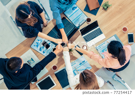 Teamwork business people join hands in meeting. 77254417