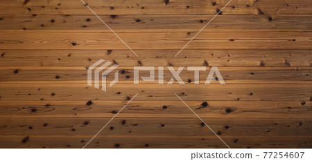 Background image of a horizontally long brown board wall with wood grain and knots 77254607