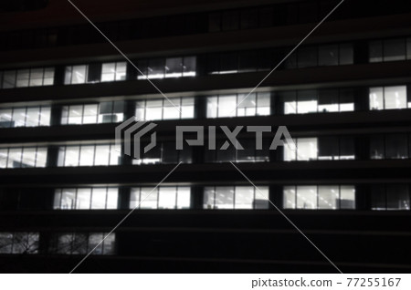 [Business image] Overtime work at midnight. The appearance of the office building at night. (* With blur processing) 77255167