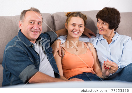 Portrait of happy family on sofa Portrait of happy family on sofa 77255356