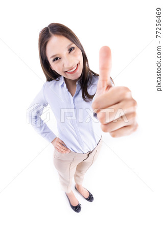 Happy smiling asian businesswoman with thumbs up gesture, isolated on white background. 77256469