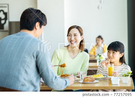 Young family eating out Young family eating out 77257095