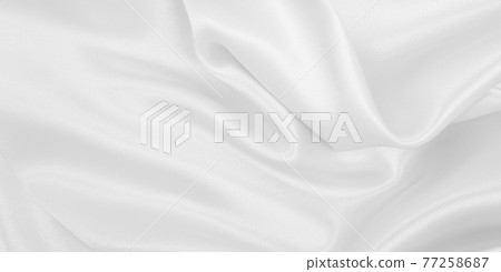 Smooth elegant white silk or satin luxury cloth texture as wedding background. Luxurious background design 77258687