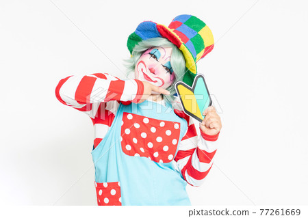 A clown with a beginner mark standing in front of a white background A clown with a beginner mark standing in front of a white background 77261669