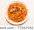 Photographing a Korean dish of pork kimchi stew on a plate. Photographing a Korean dish of pork kimchi stew on a plate. 77262592