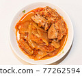 Photographing a Korean dish of pork kimchi stew on a plate. Photographing a Korean dish of pork kimchi stew on a plate. 77262594