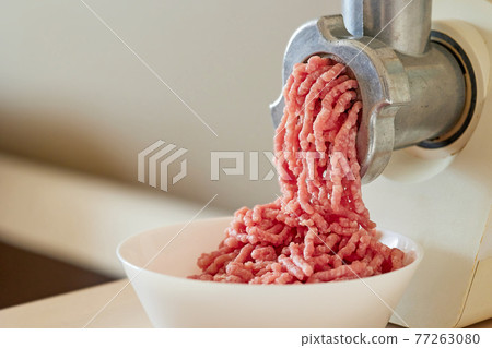 mince the meat with an electric meat mincer mince the meat with an electric meat mincer 77263080