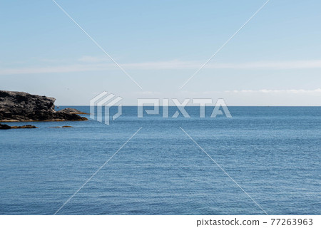 Rocky shore of the Mediterranean Sea in Spain on a beautiful sunny day 77263963