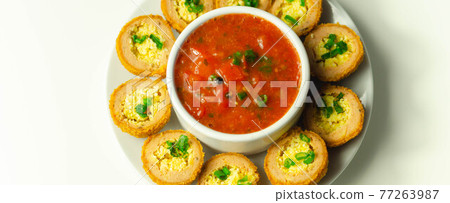 Mini scotch eggs with tomato sauce served on the white ceramic plate Mini scotch eggs with tomato sauce served on the white ceramic plate 77263987