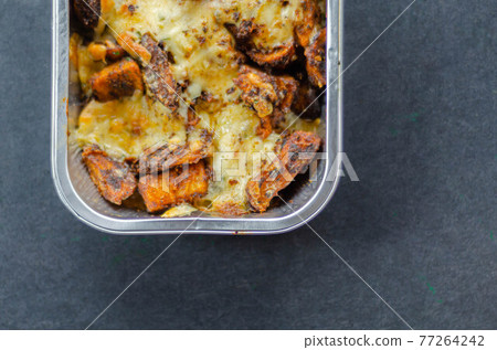 Fried potato fries coated topped with mature cheddar and Monterey Jack cheeses, jalapeno and bacon sauce, finished with mozzarella and parsley Fried potato fries coated topped with mature cheddar and Monterey Jack cheeses, jalapeno and bacon sauce, finished with mozzarella and parsley 77264242