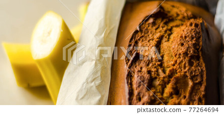 Freshly baked banana cake with nuts, banana bread in baking form Freshly baked banana cake with nuts, banana bread in baking form 77264694