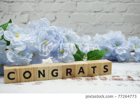 Congrats alphabet letter with space copy on wooden background 77264773