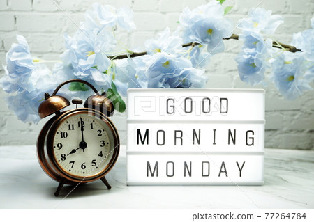 Good Morning Monday word in light box with Flowers Decoration 77264784