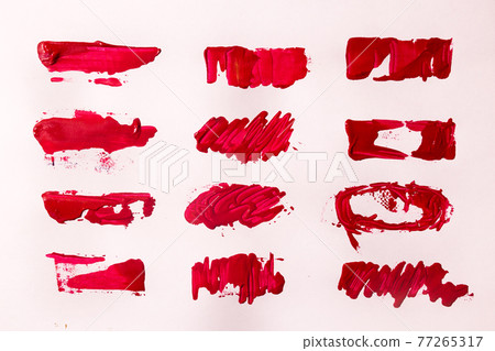 red oil paint brush strokes on paper. red oil paint brush strokes on paper. 77265317